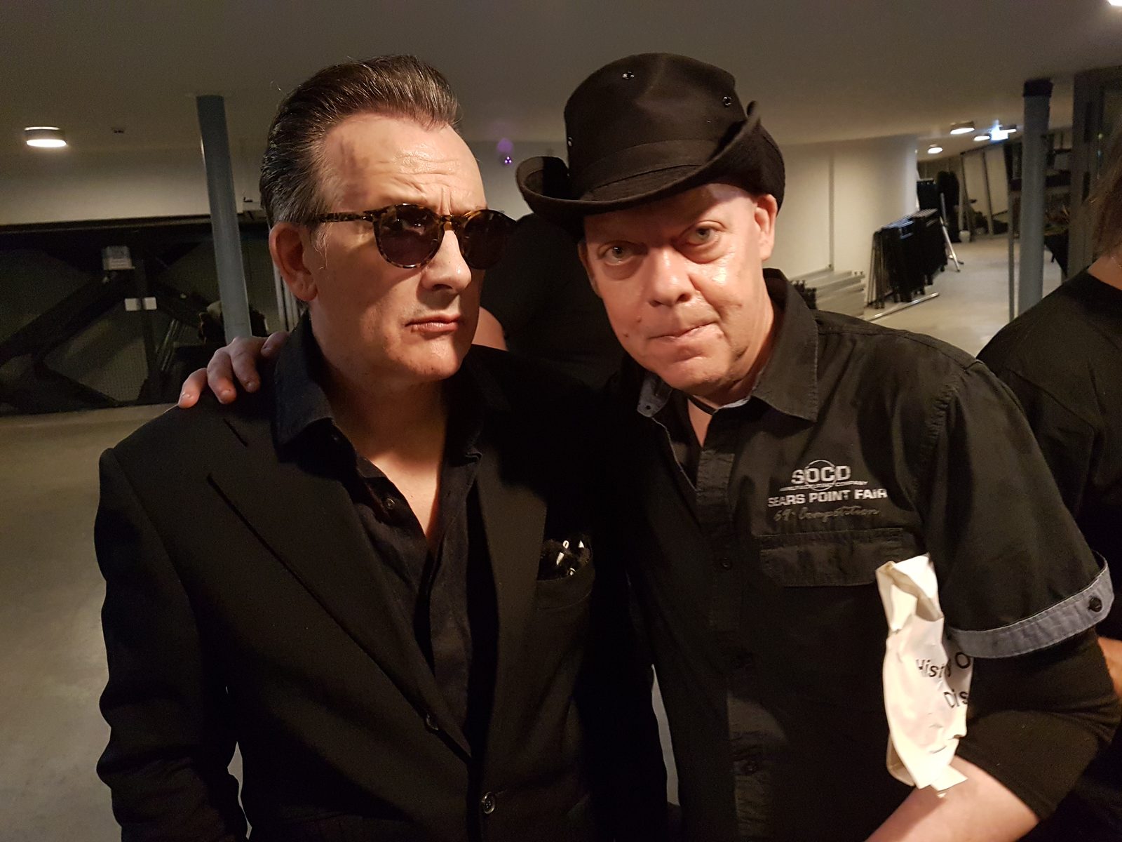 Two men posing after the concert