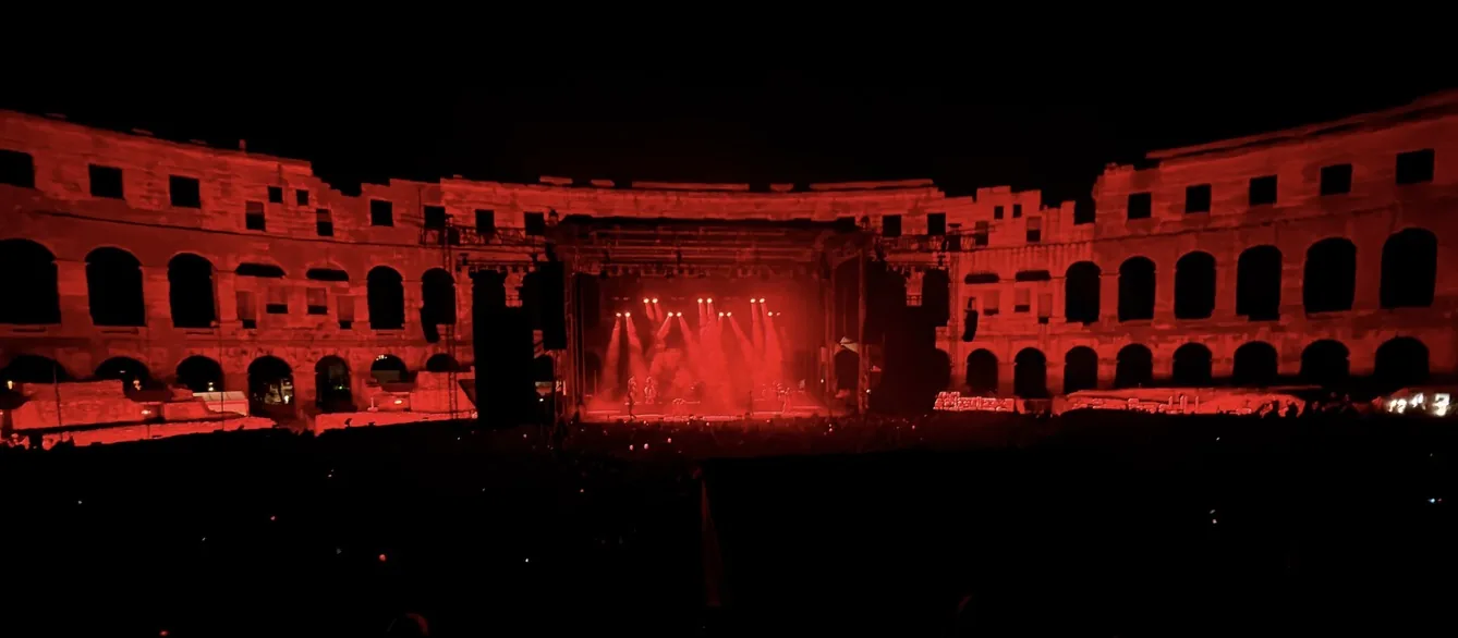 Pula Arena lit red during the show